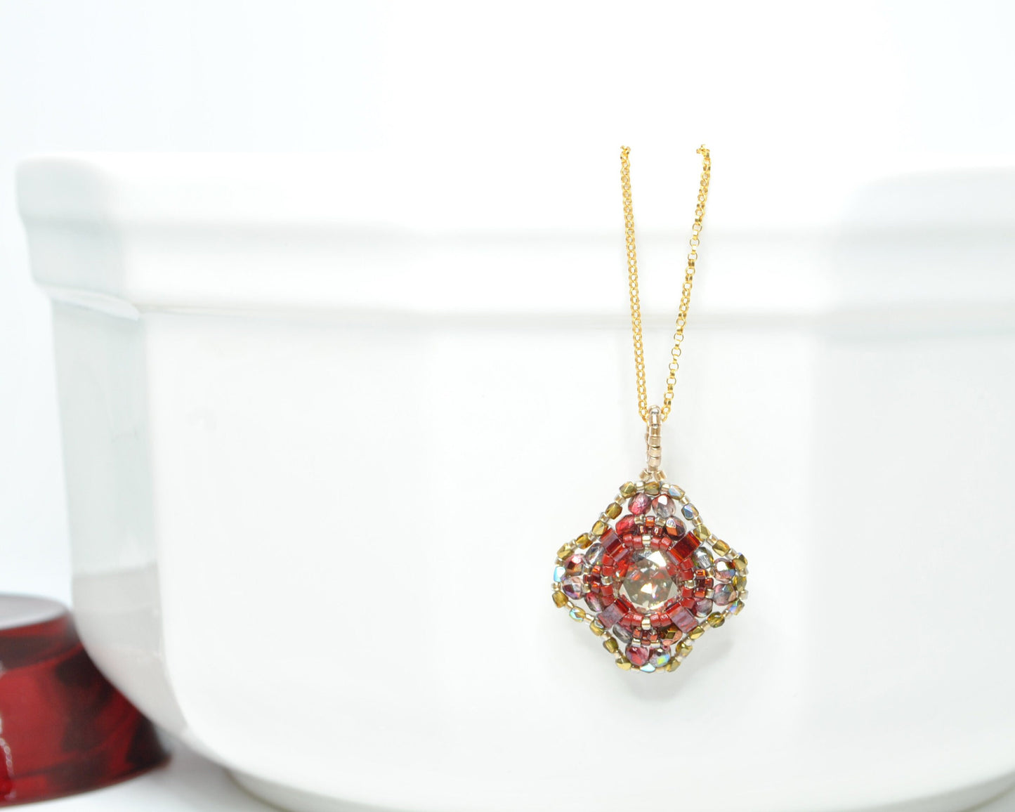 red and gold swarovski crystal cushion cut pendant . #029