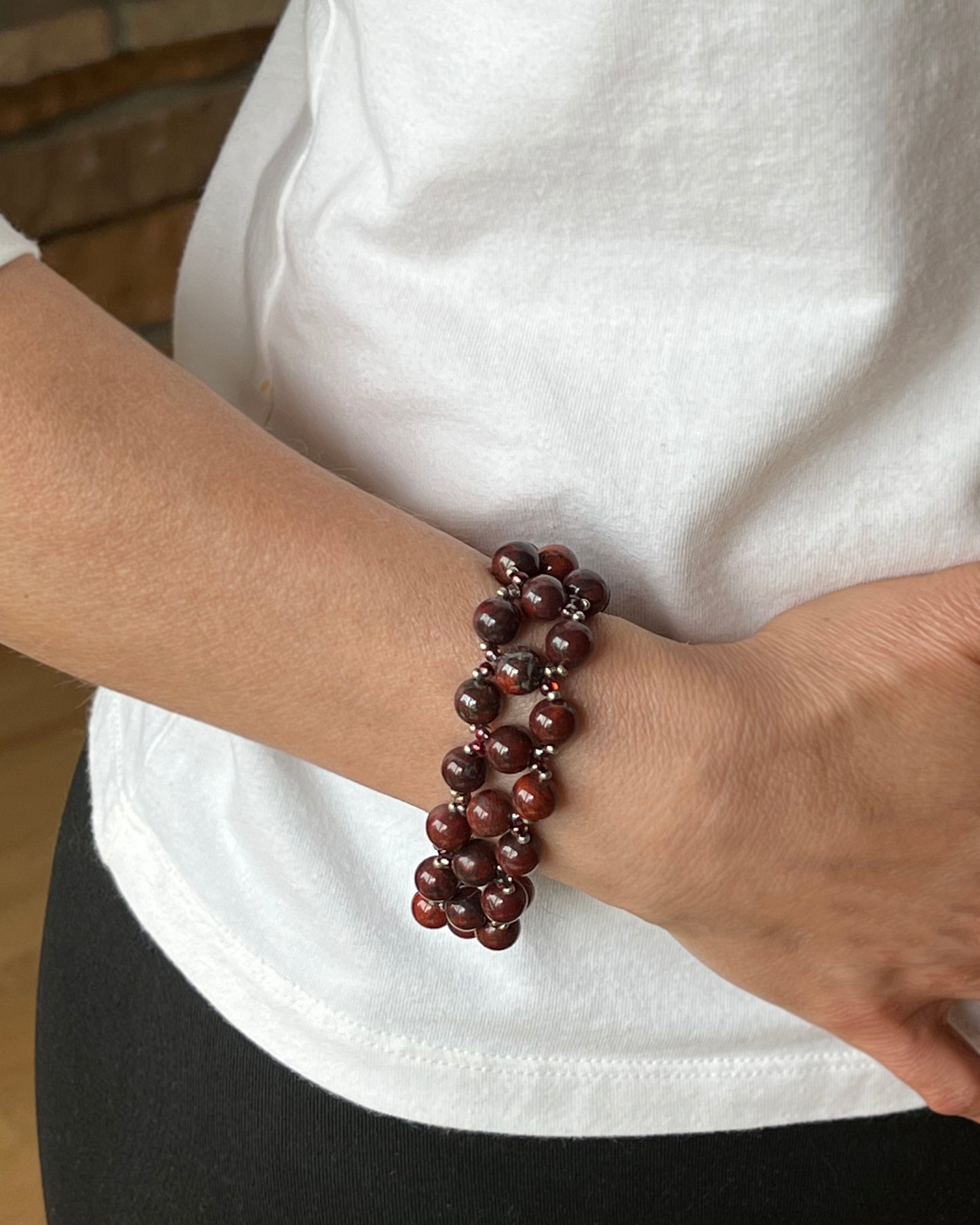 red poppy jasper bracelet, on wrist