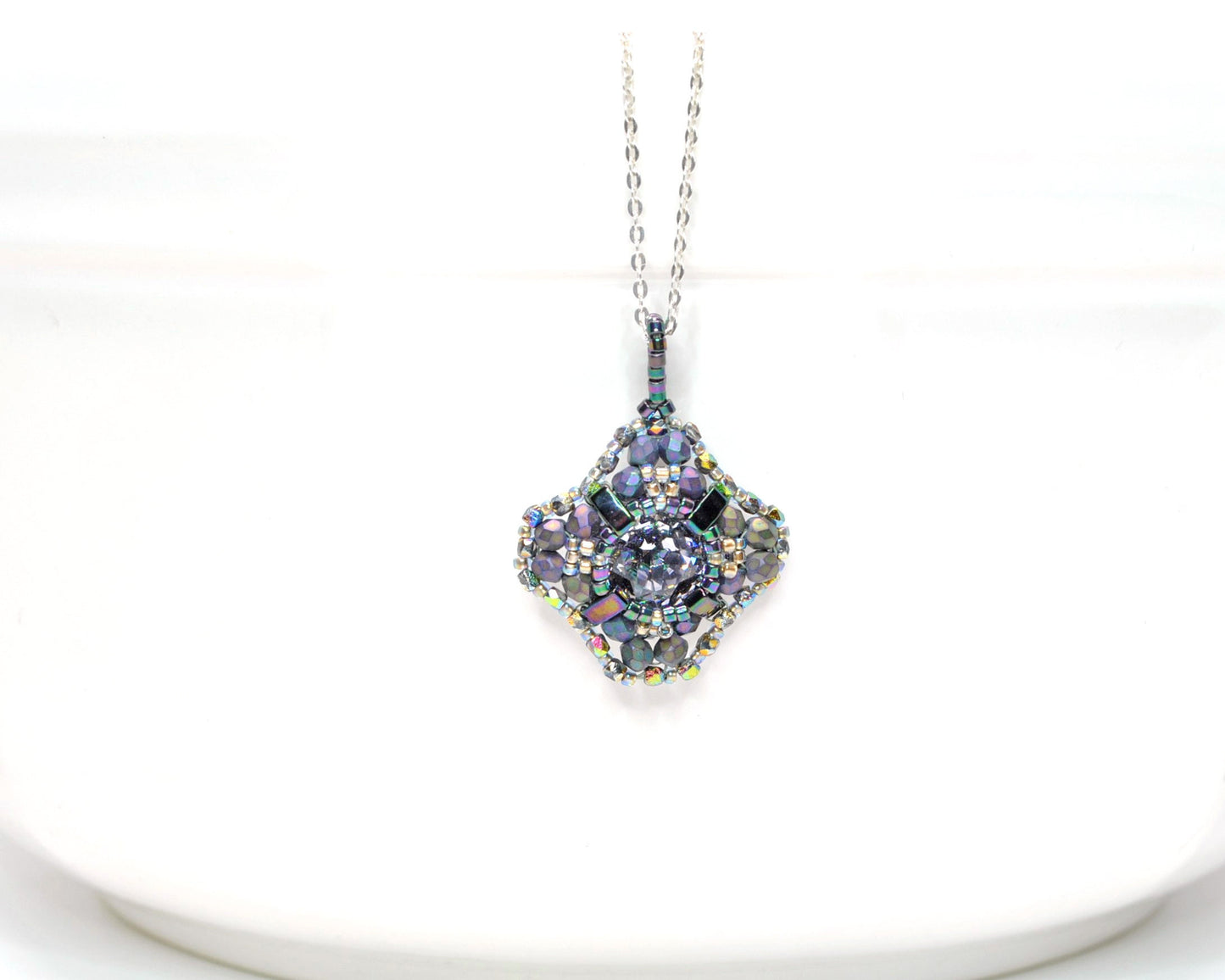purple metallic swarovski cushion cut pendant .  #021