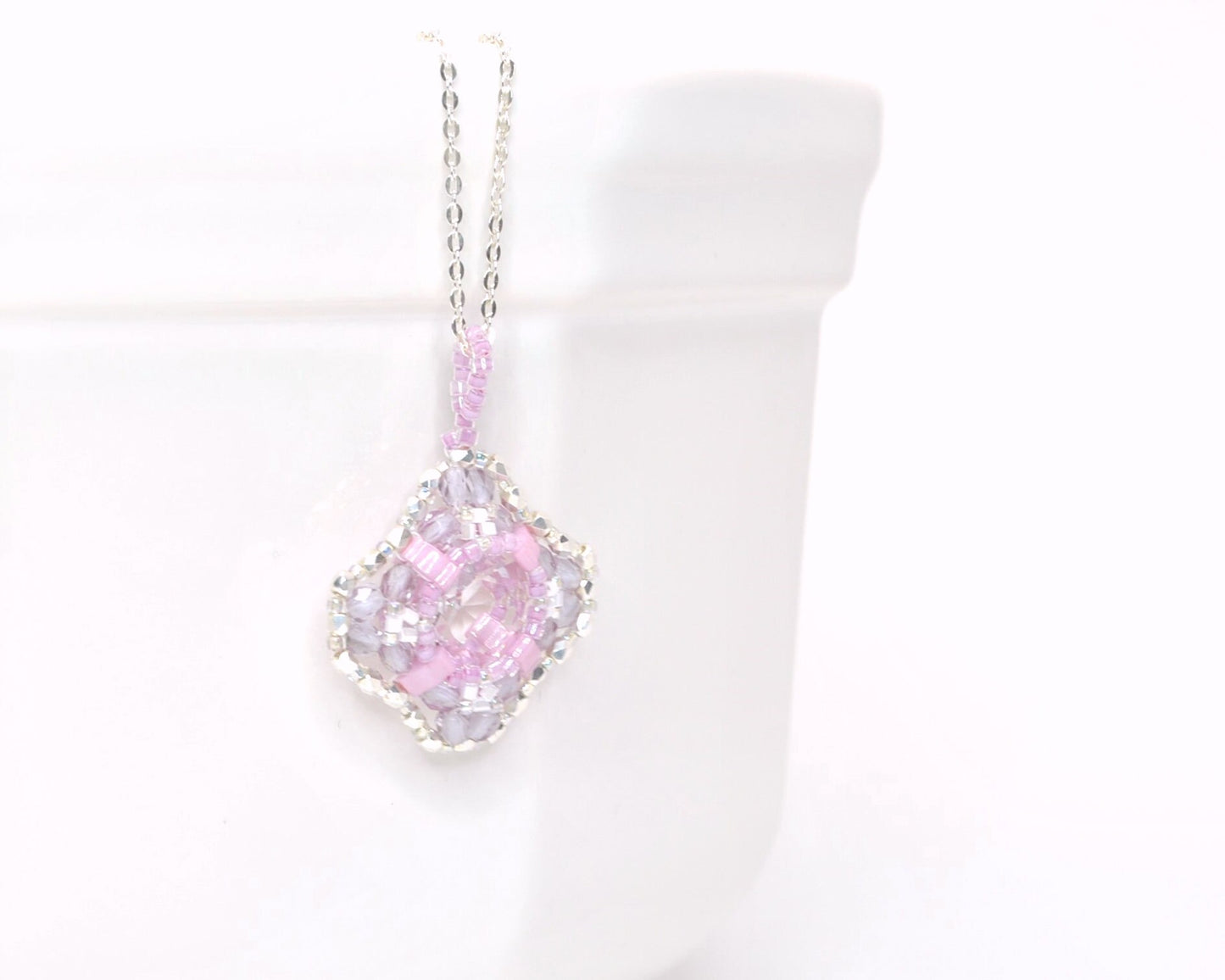 clear cushion cut crystal pendant with orchid pink beads . #026