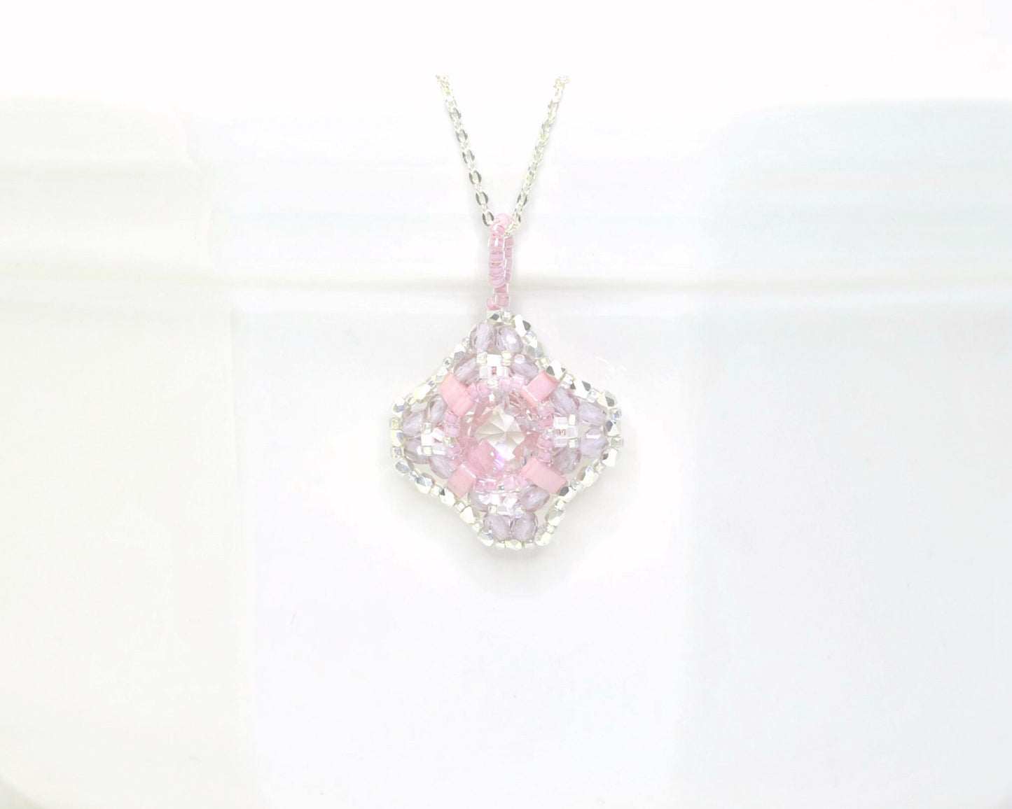 clear cushion cut crystal pendant with orchid pink beads . #026