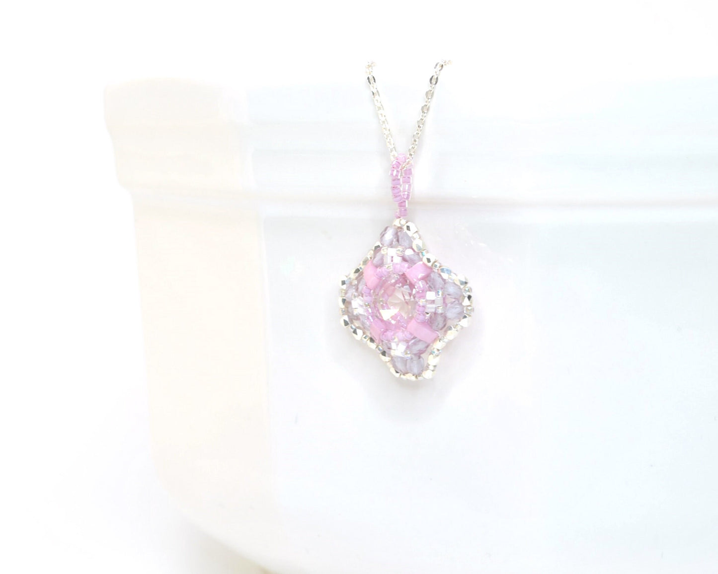 clear cushion cut crystal pendant with orchid pink beads . #026