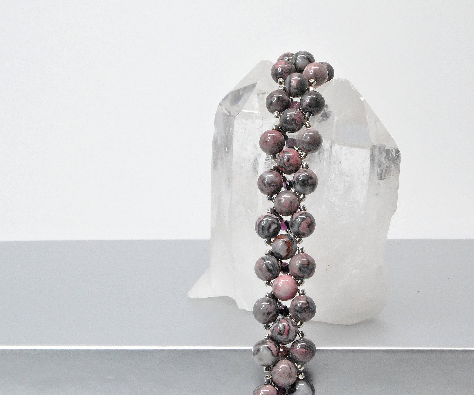 rhodonite and black lace ruby beaded bracelet . pink and black bracelet .